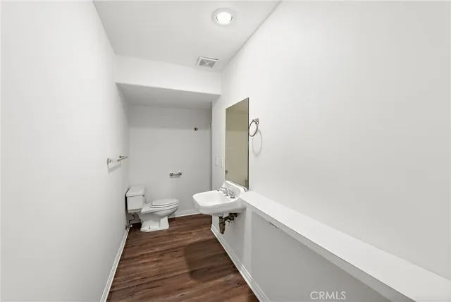 a bathroom with a sink a toilet and a bathtub