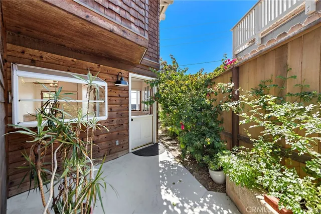 a view of front door and potted plants