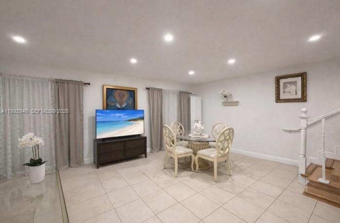 a living room with furniture a desk and chair