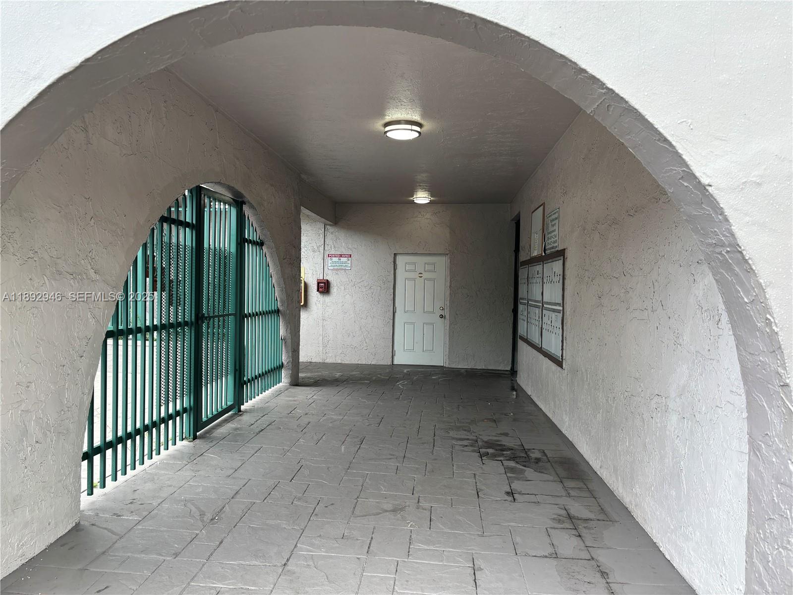 1350 West 53rd Street, Unit 24 Hialeah, FL 33012 - Photo 11 of 32 a view of a hallway