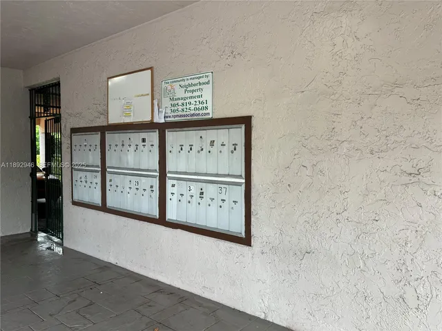 a view of a hallway with paintings on the wall
