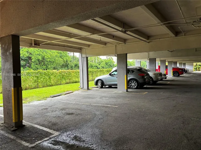 a view of a car parked in back of a building