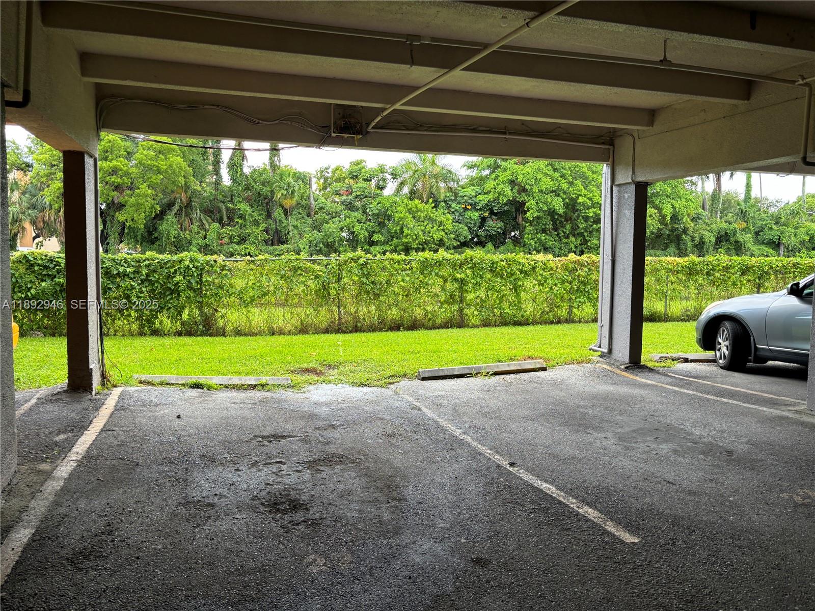1350 West 53rd Street, Unit 24 Hialeah, FL 33012 - Photo 15 of 32 a view of a garden with an outdoor space