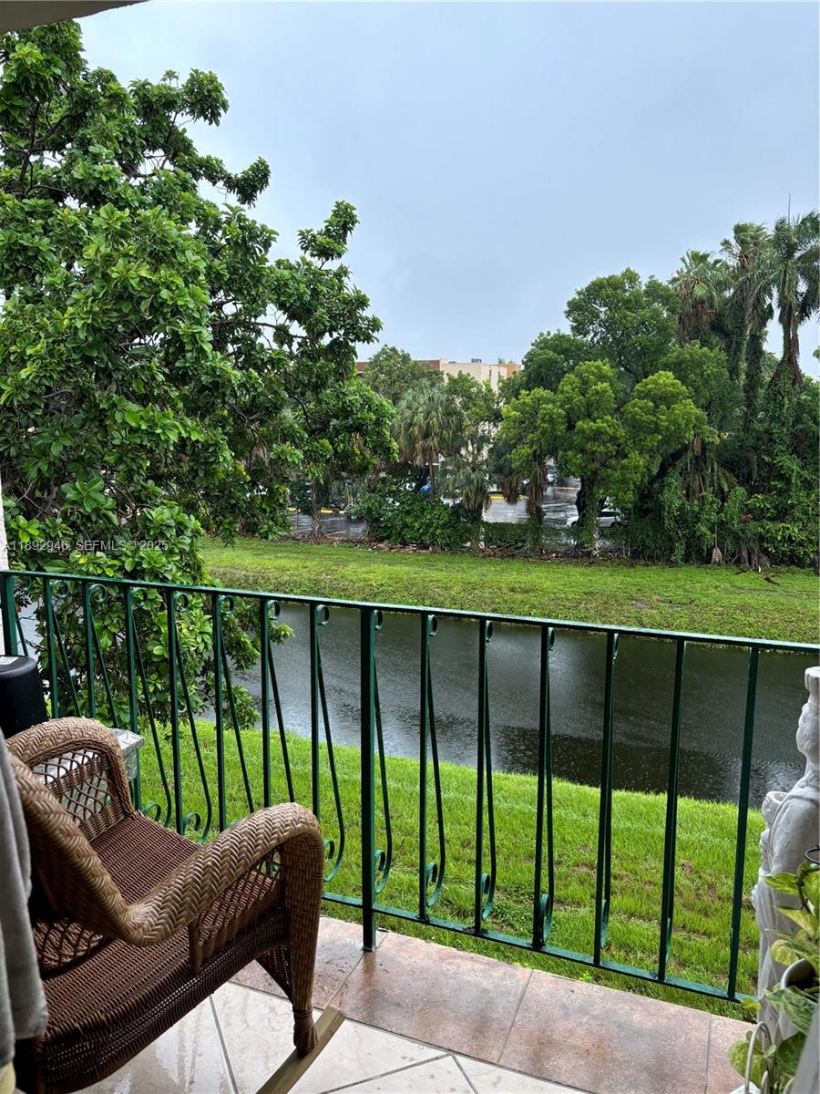 1350 West 53rd Street, Unit 24 Hialeah, FL 33012 - Photo 18 of 32 a view of a two chairs in the roof deck