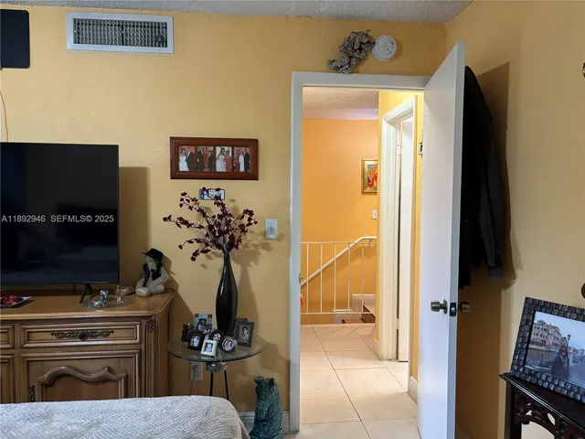 a view of living room with furniture and a flat screen tv