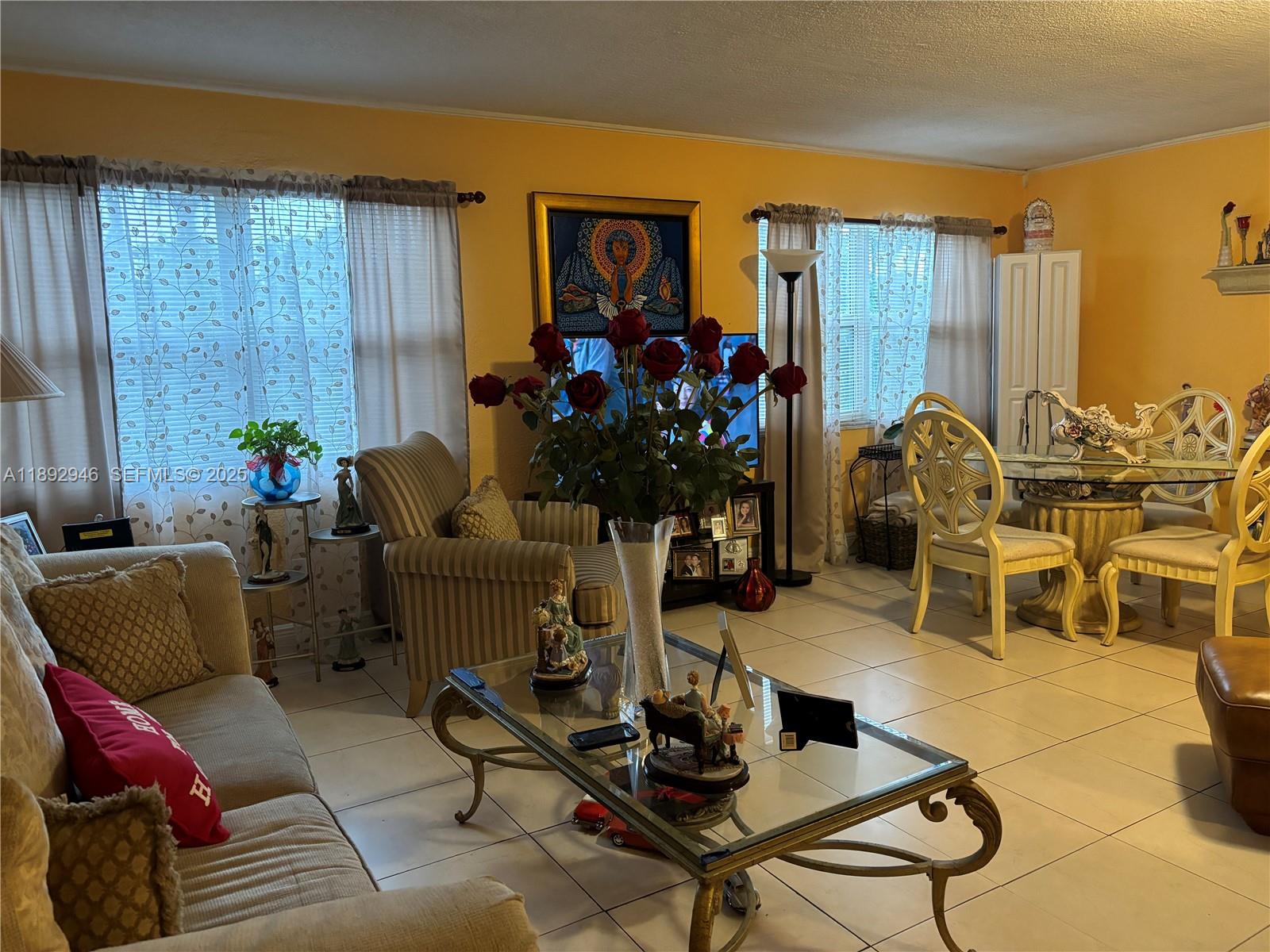 1350 West 53rd Street, Unit 24 Hialeah, FL 33012 - Photo 27 of 32 a living room with furniture