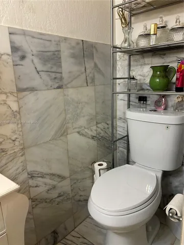 a bathroom with a toilet and a sink