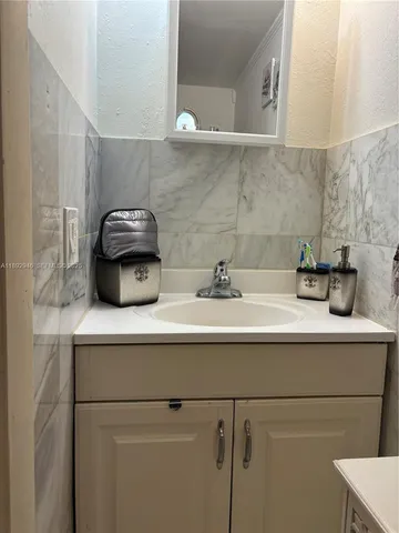 a sink with a potted plant