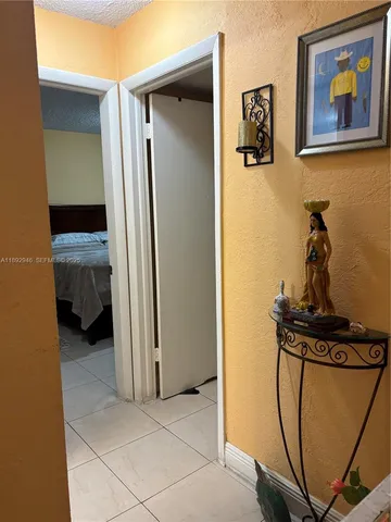 a view of a hallway with a room