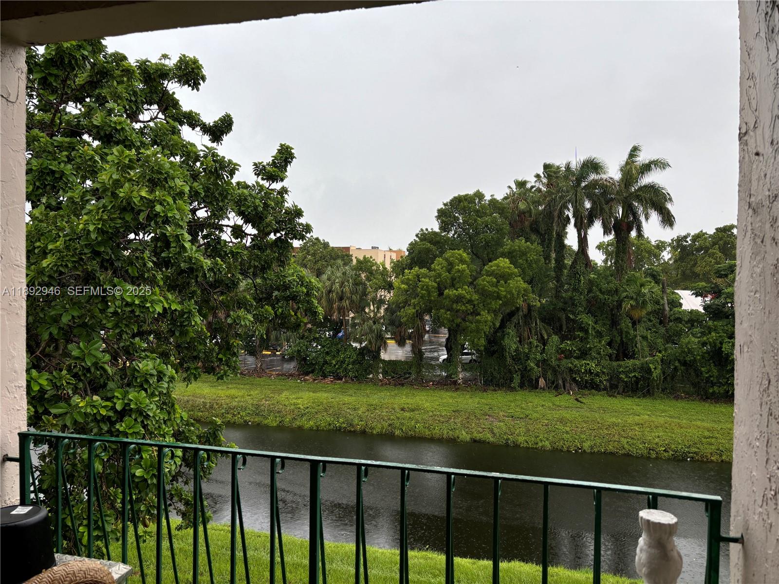 1350 West 53rd Street, Unit 24 Hialeah, FL 33012 - Photo 7 of 32 a view of a balcony with a garden