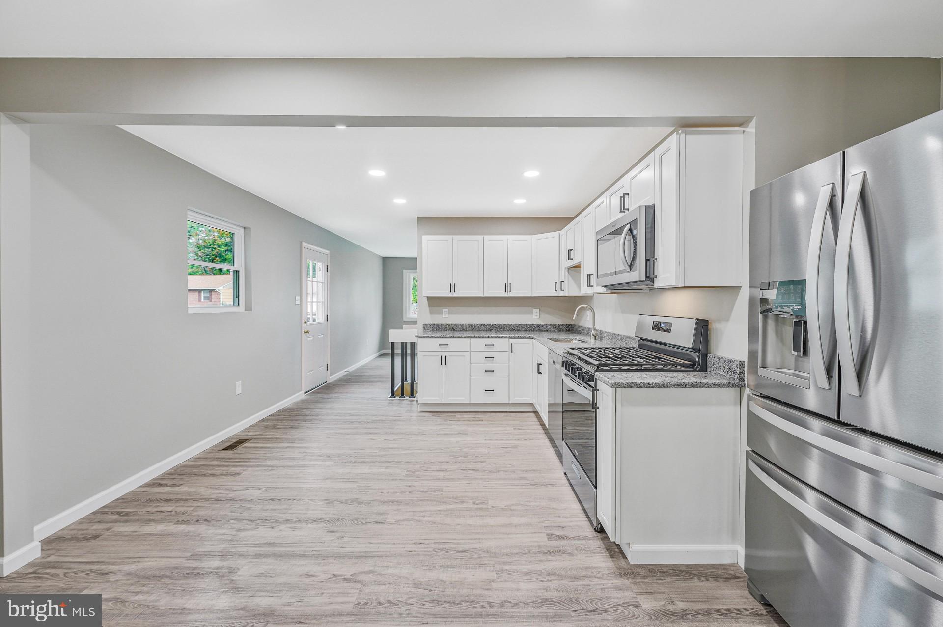 237 Candytuft Road Reisterstown, MD 21136 - Photo 15 of 34 a kitchen with stainless steel appliances granite countertop a refrigerator and a stove top oven