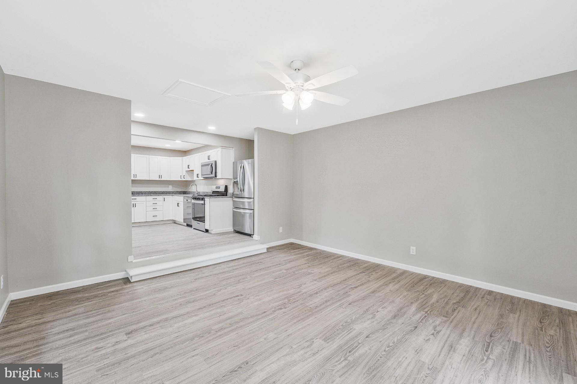 237 Candytuft Road Reisterstown, MD 21136 - Photo 19 of 34 a view of a kitchen with wooden floor and a kitchen