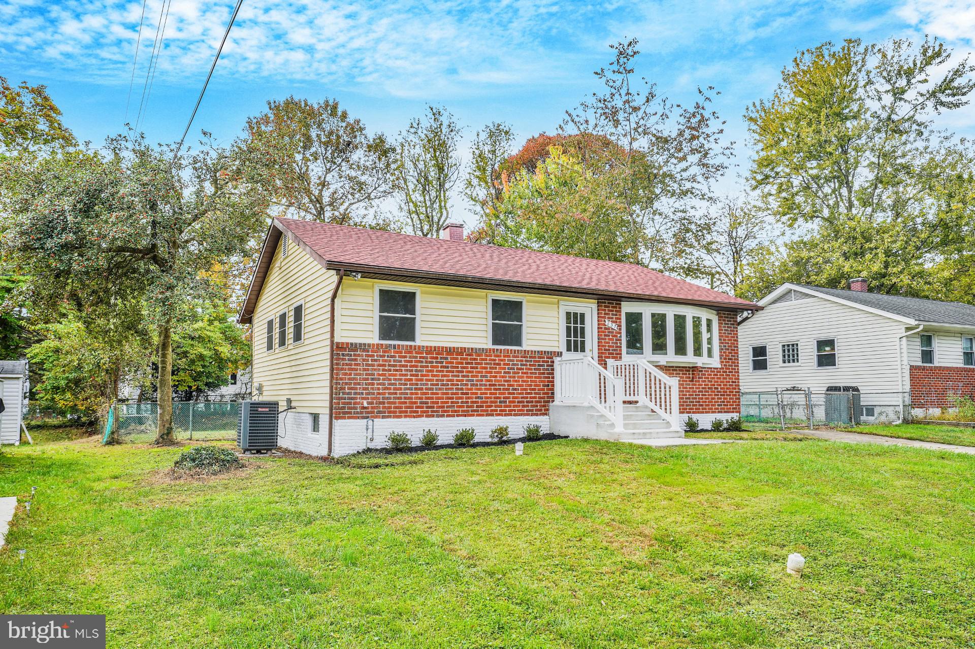 237 Candytuft Road Reisterstown, MD 21136 - Photo 2 of 34 a front view of house with yard and trees in the background