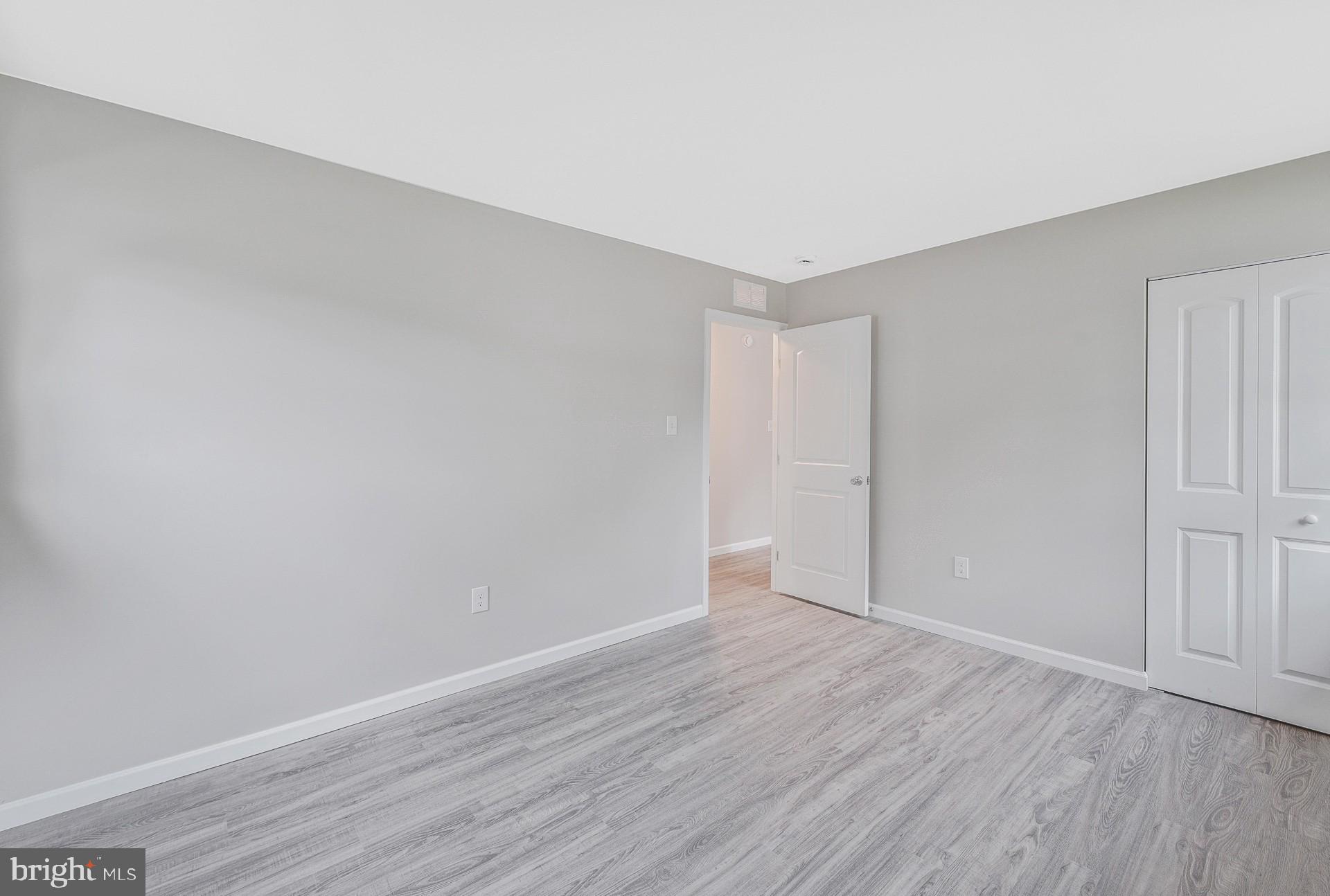 237 Candytuft Road Reisterstown, MD 21136 - Photo 22 of 34 a view of an empty room with wooden floor