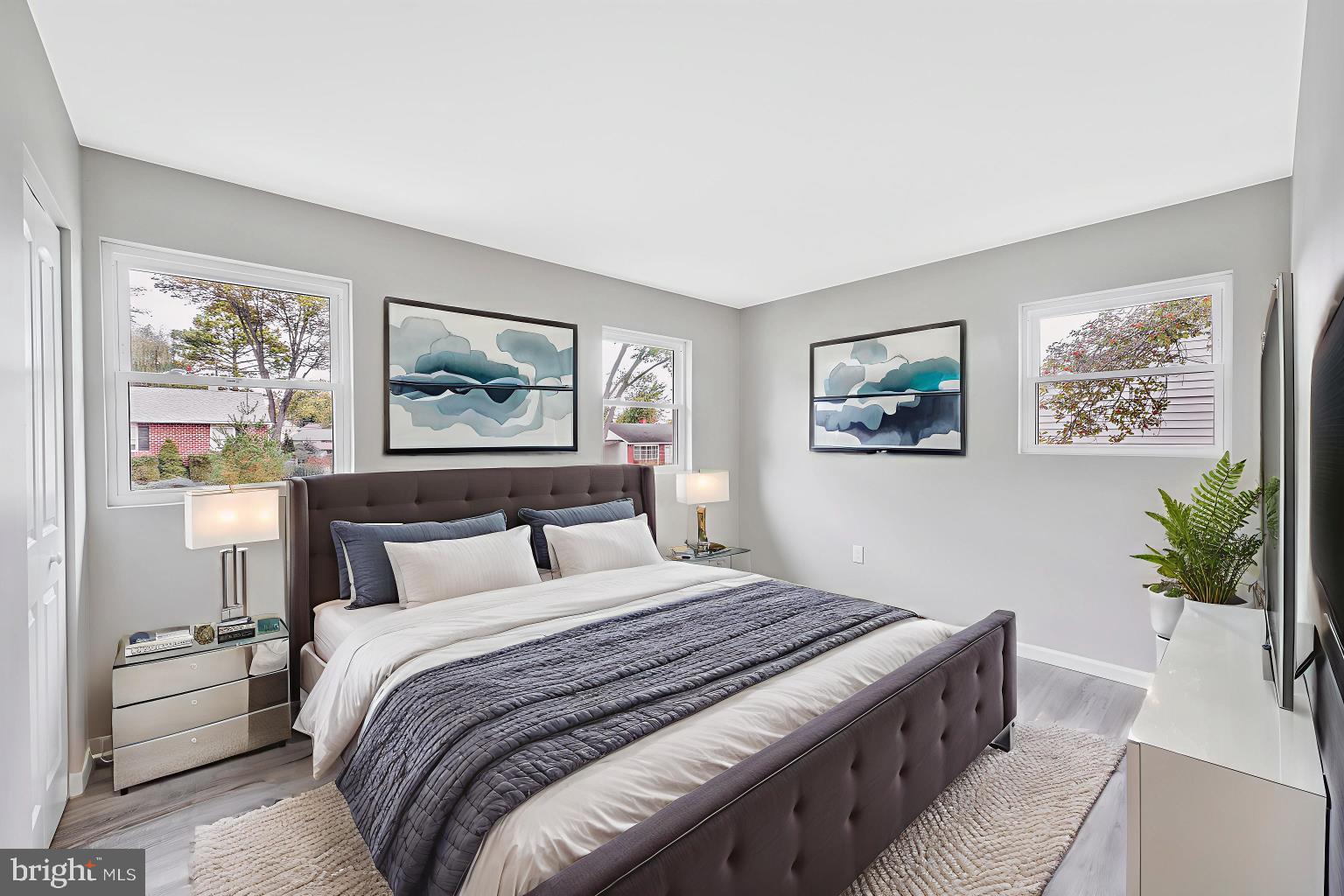 237 Candytuft Road Reisterstown, MD 21136 - Photo 24 of 34 a bedroom with a large bed and a painting on the wall