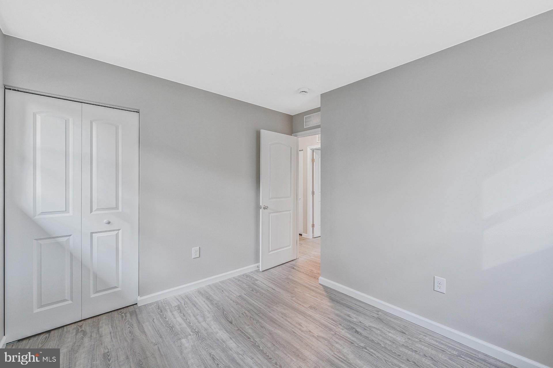 237 Candytuft Road Reisterstown, MD 21136 - Photo 25 of 34 a view of an empty room with wooden floor