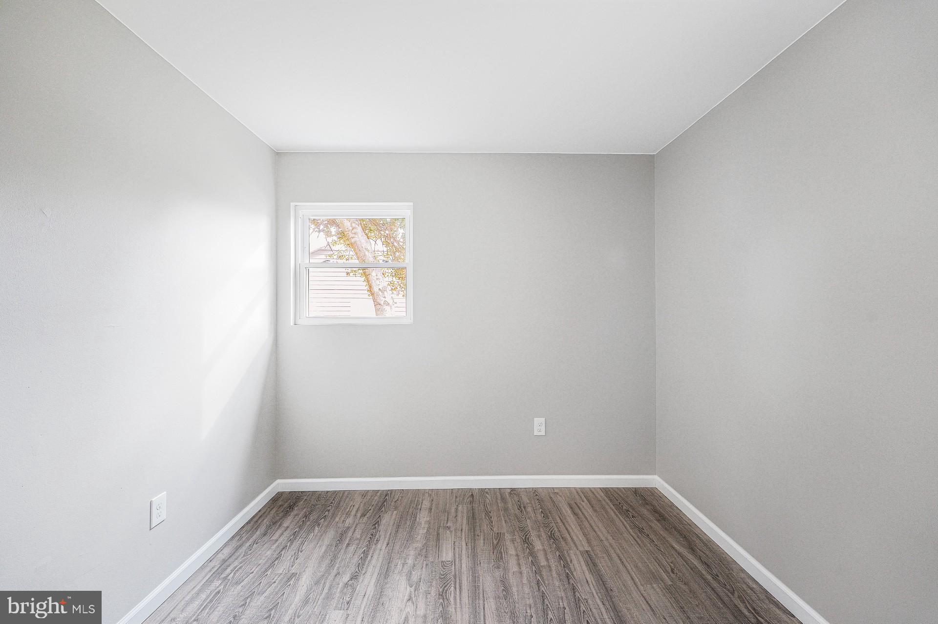 237 Candytuft Road Reisterstown, MD 21136 - Photo 29 of 34 a view of an empty room with wooden floor and a window