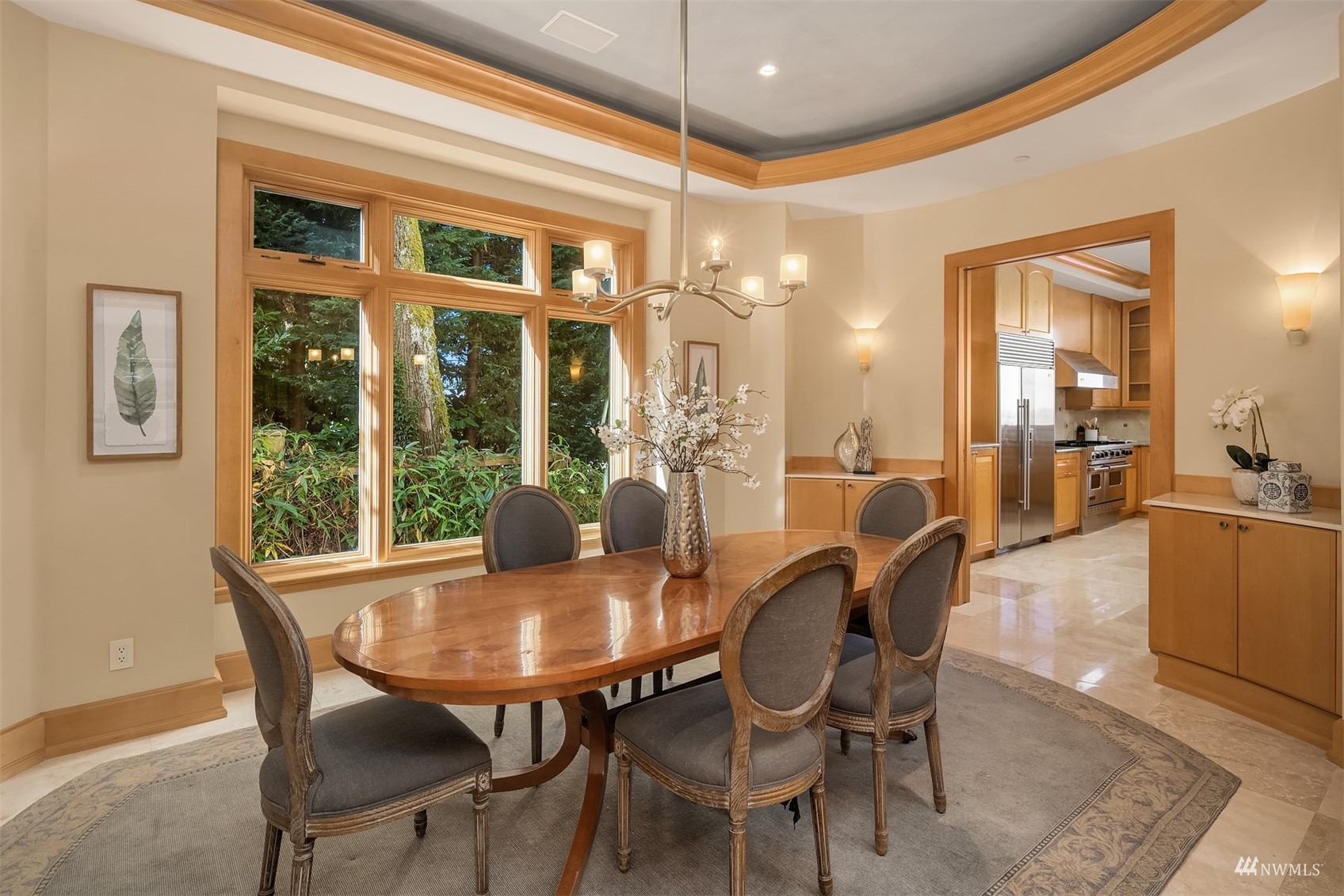 3235 Evergreen Point Road Medina, WA 98039 - Photo 11 of 39 a dining room with furniture a chandelier and wooden floor