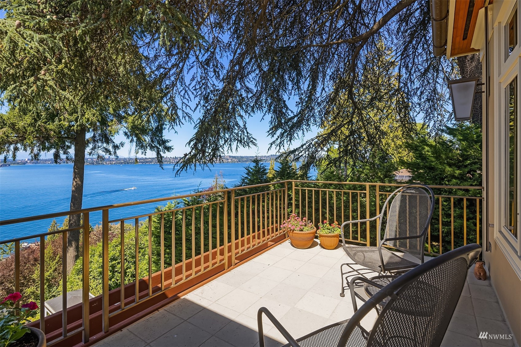 3235 Evergreen Point Road Medina, WA 98039 - Photo 12 of 39 a view of balcony with wooden floor and outdoor seating