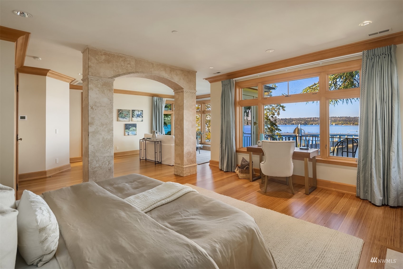 3235 Evergreen Point Road Medina, WA 98039 - Photo 16 of 39 a bedroom with a bed and large windows with outer view