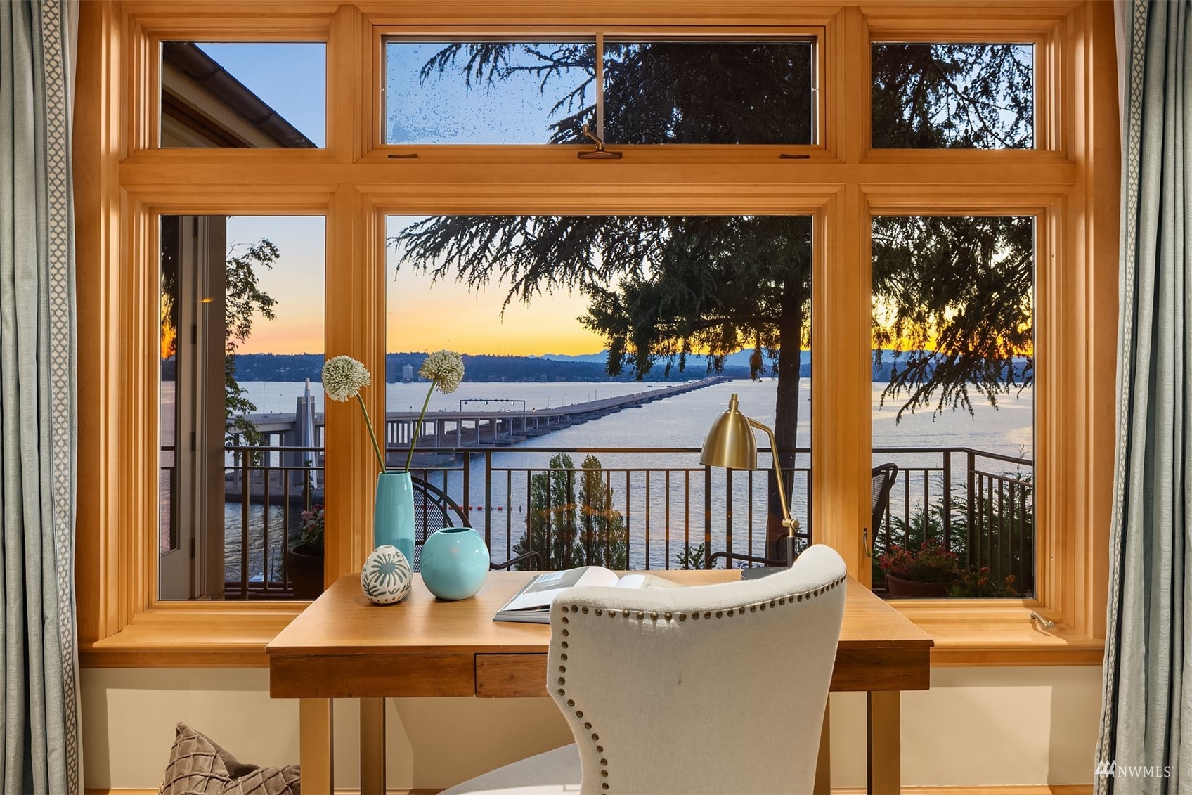 3235 Evergreen Point Road Medina, WA 98039 - Photo 18 of 39 a view of a patio with a table and chairs and potted plants