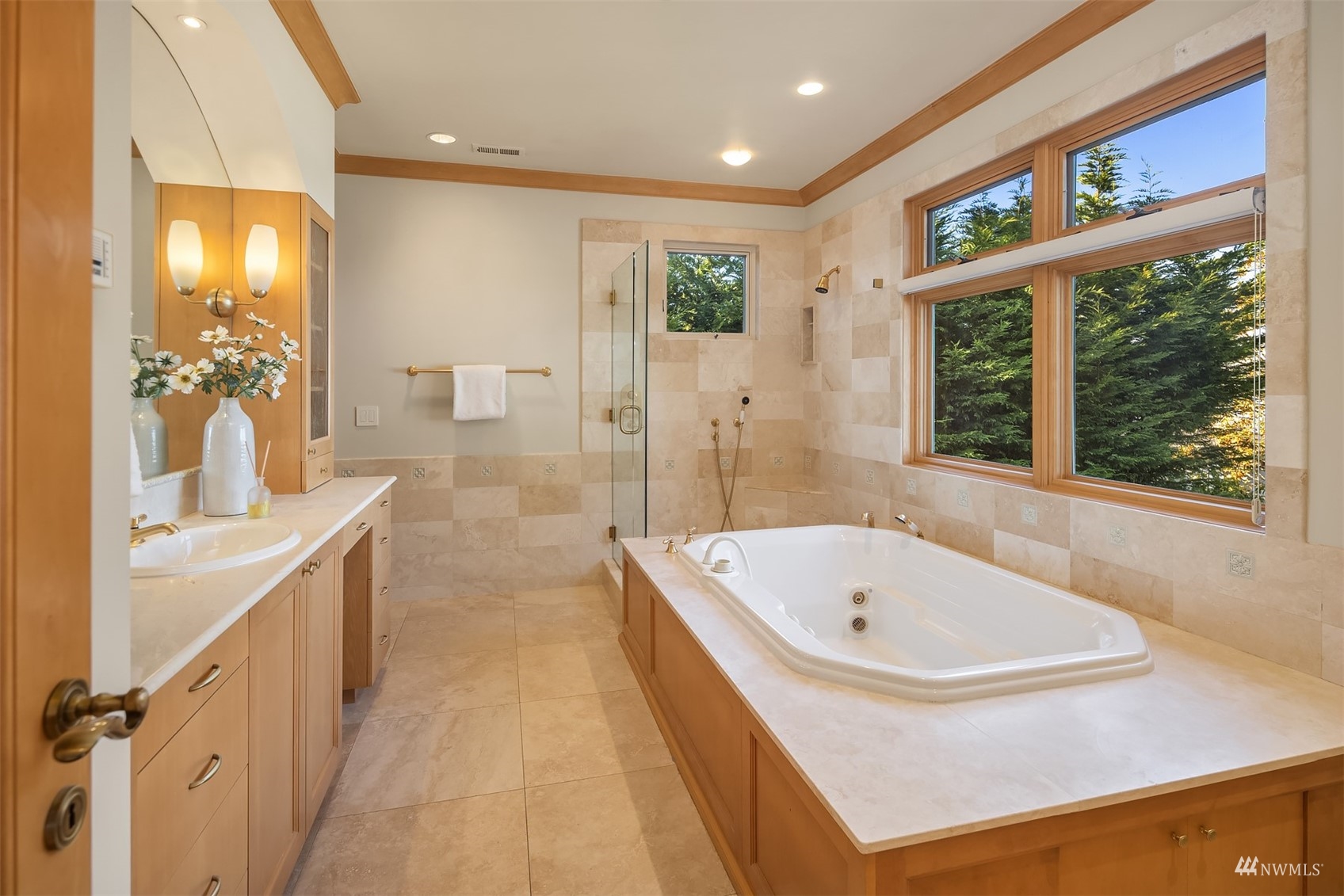 3235 Evergreen Point Road Medina, WA 98039 - Photo 19 of 39 a bathroom with a tub a sink and a large window