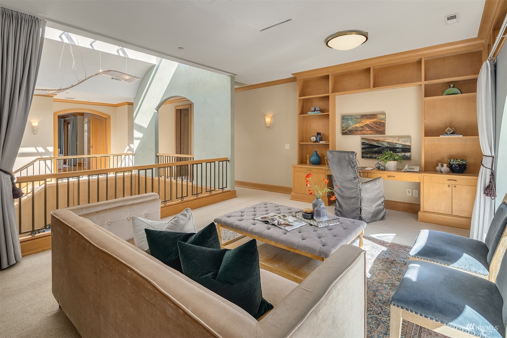 3235 Evergreen Point Road Medina, WA 98039 - Photo 21 of 39 a living room with stainless steel appliances kitchen island granite countertop a table and chairs in it