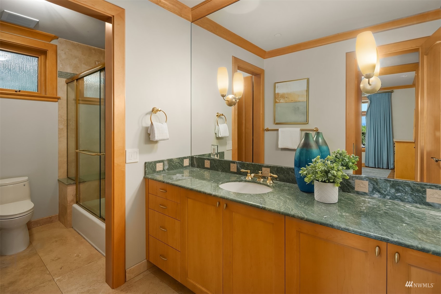 3235 Evergreen Point Road Medina, WA 98039 - Photo 29 of 39 a bathroom with sink and mirror