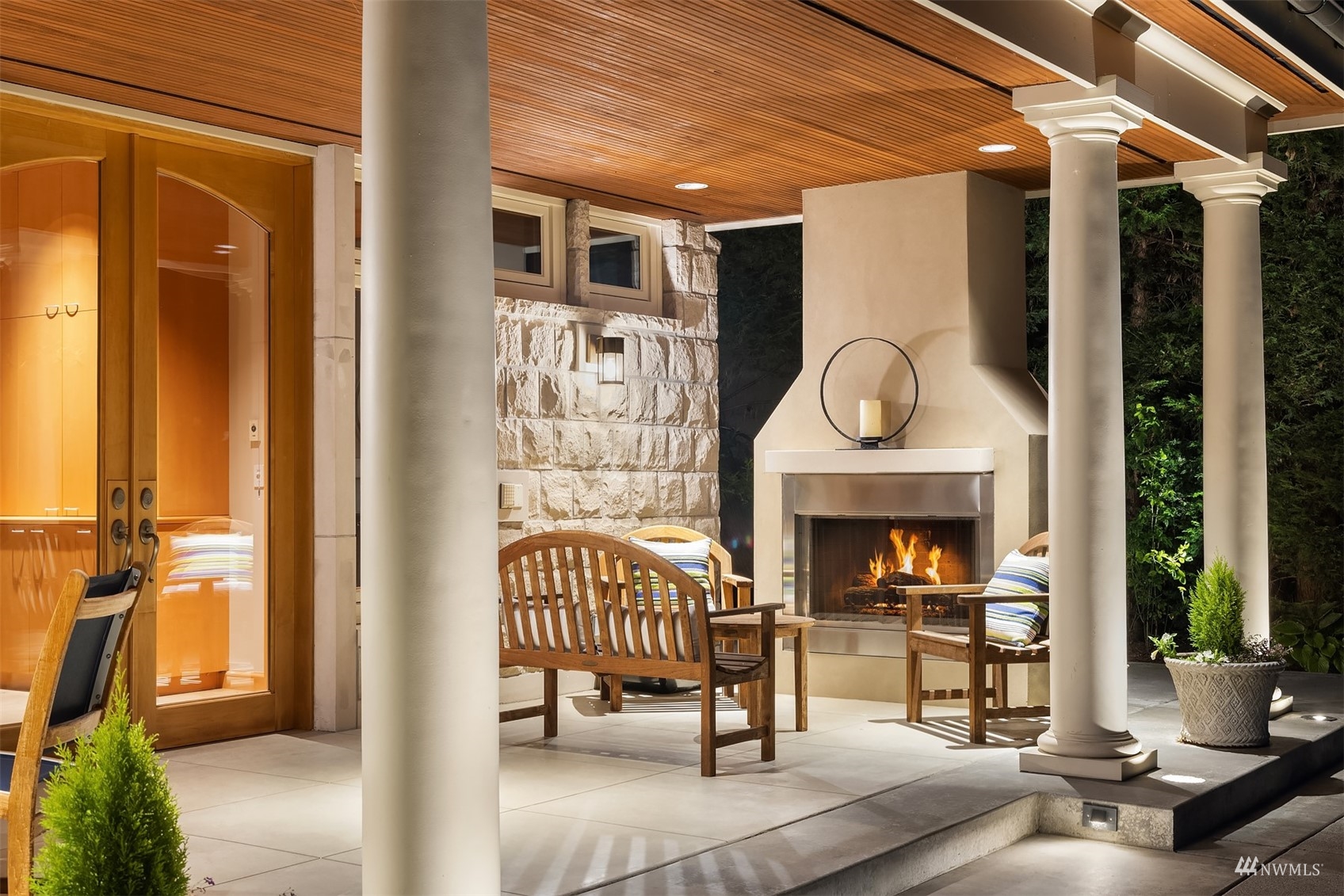 3235 Evergreen Point Road Medina, WA 98039 - Photo 34 of 39 a living room with furniture a fireplace and a potted plant