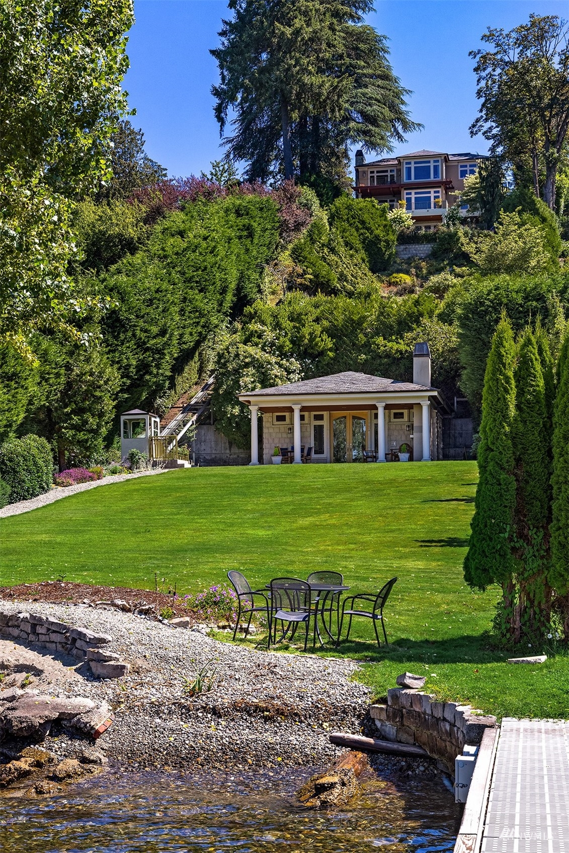 3235 Evergreen Point Road Medina, WA 98039 - Photo 37 of 39 a front view of a house with a yard