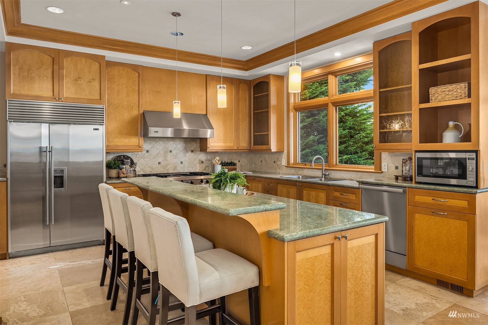 3235 Evergreen Point Road Medina, WA 98039 - Photo 9 of 39 a kitchen with a stove a sink and a refrigerator