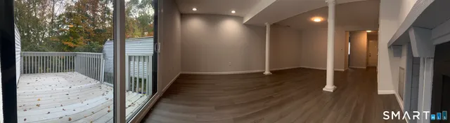 a view of hallway with wooden floor