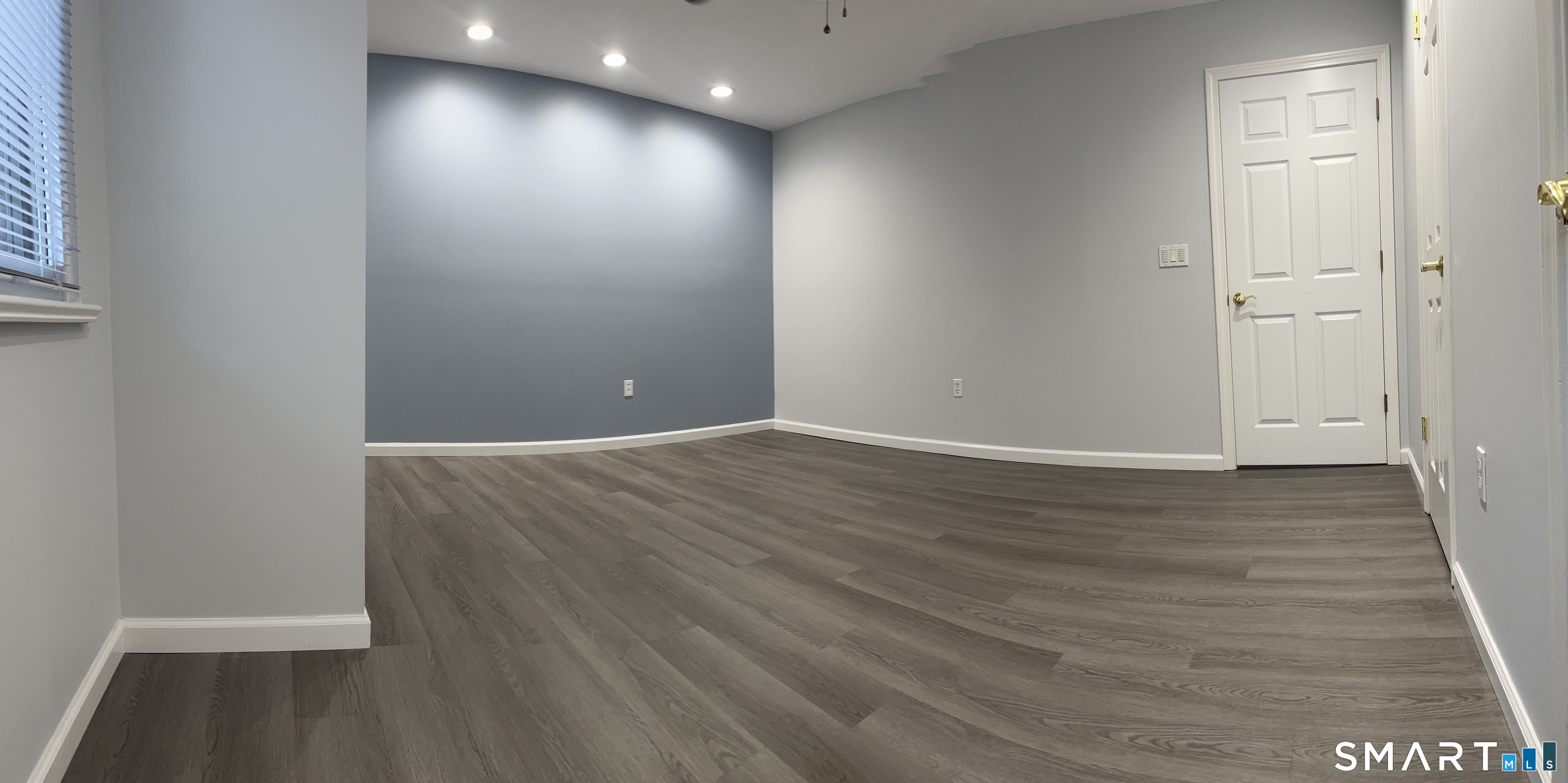 221 Cottonwood Road, Unit 221 Newington, CT 06111 - Photo 8 of 26 wooden floor in an empty room
