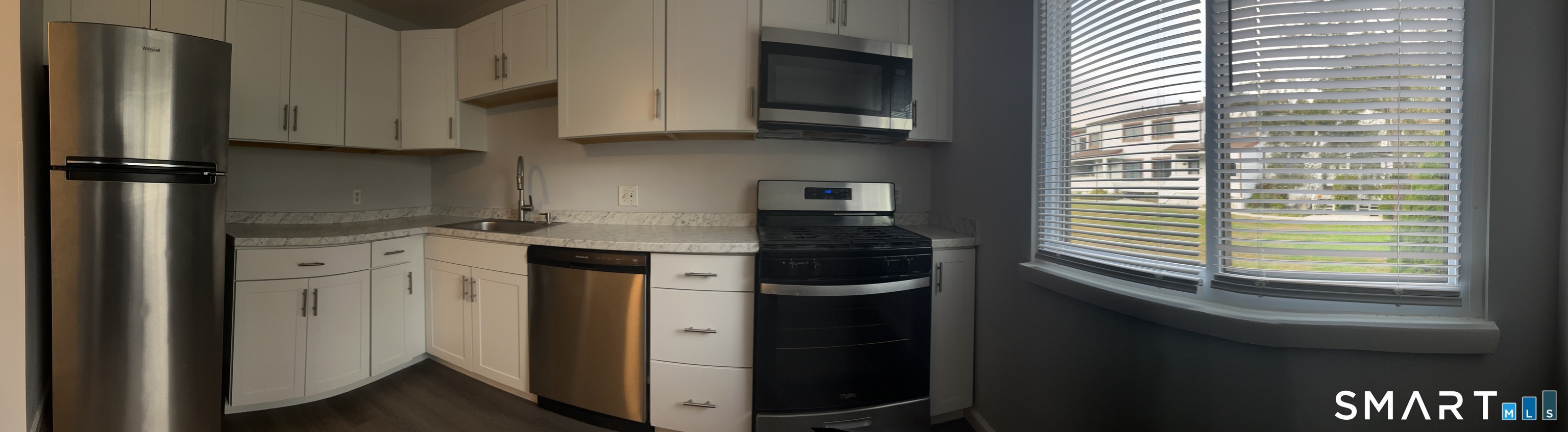 221 Cottonwood Road, Unit 221 Newington, CT 06111 - Photo 10 of 26 a kitchen with stainless steel appliances granite countertop a refrigerator and a stove