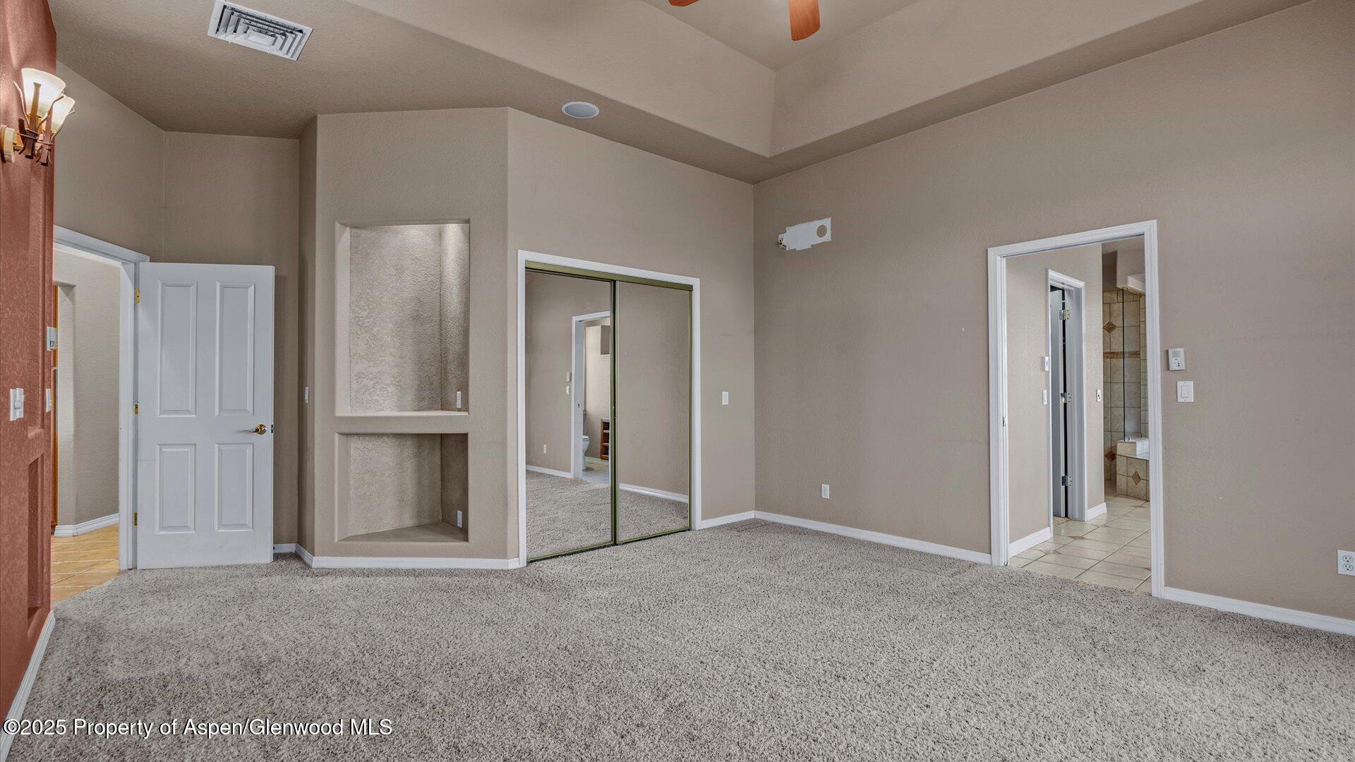 2426 H Road Grand Junction, CO 81505 - Photo 19 of 39 an empty room with closet and a bathroom