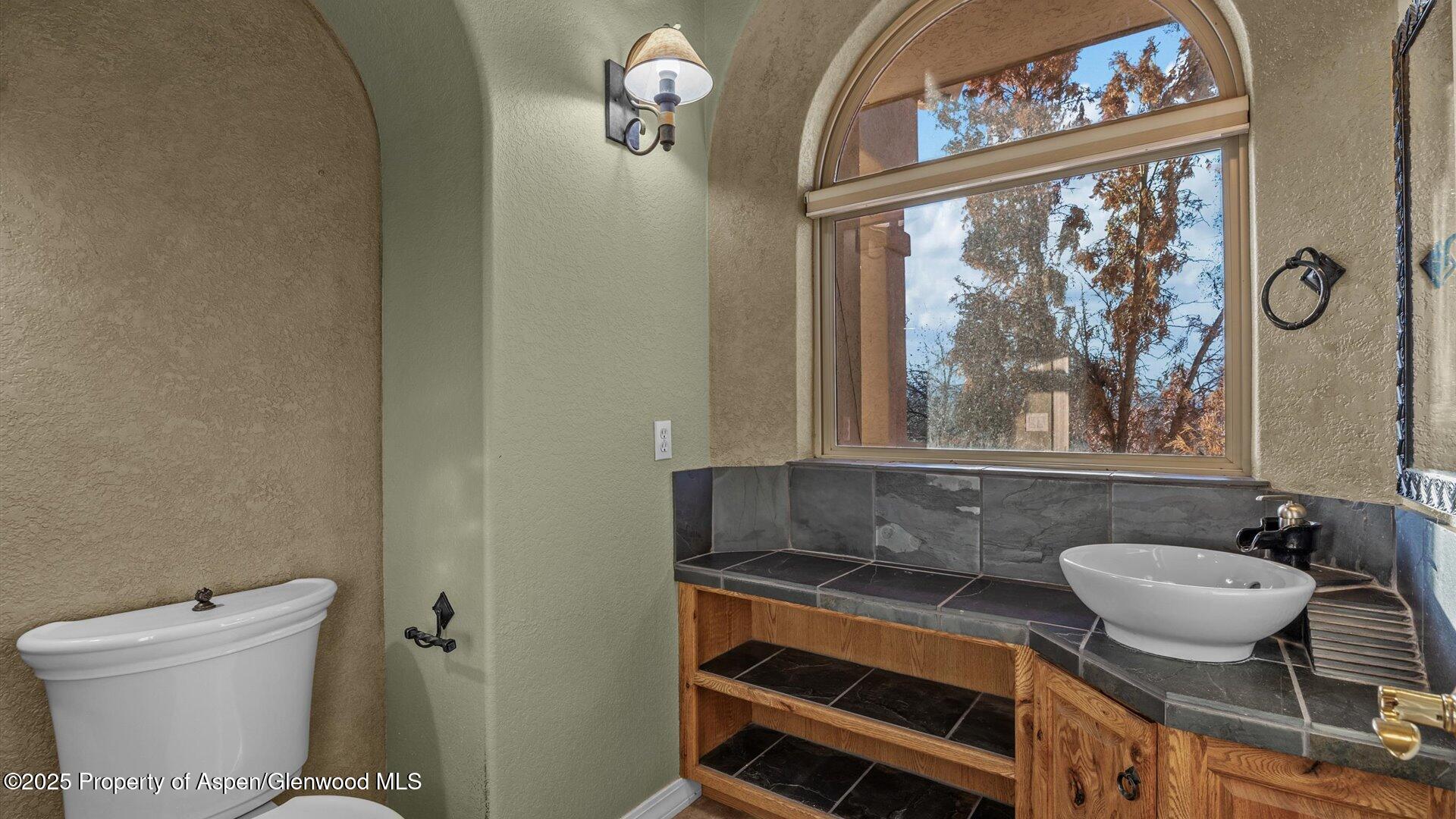 2426 H Road Grand Junction, CO 81505 - Photo 22 of 39 a bathroom with a sink and a mirror