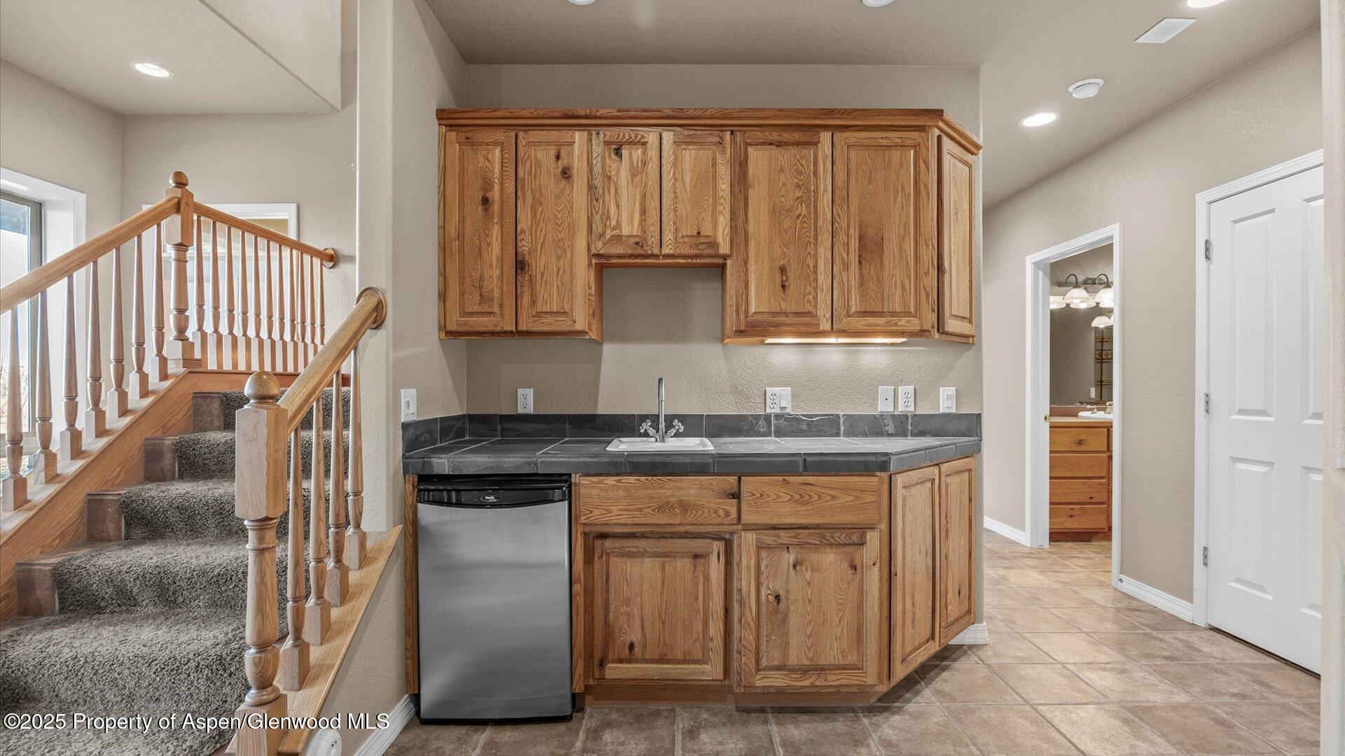 2426 H Road Grand Junction, CO 81505 - Photo 25 of 39 a kitchen with a cabinets and chandelier