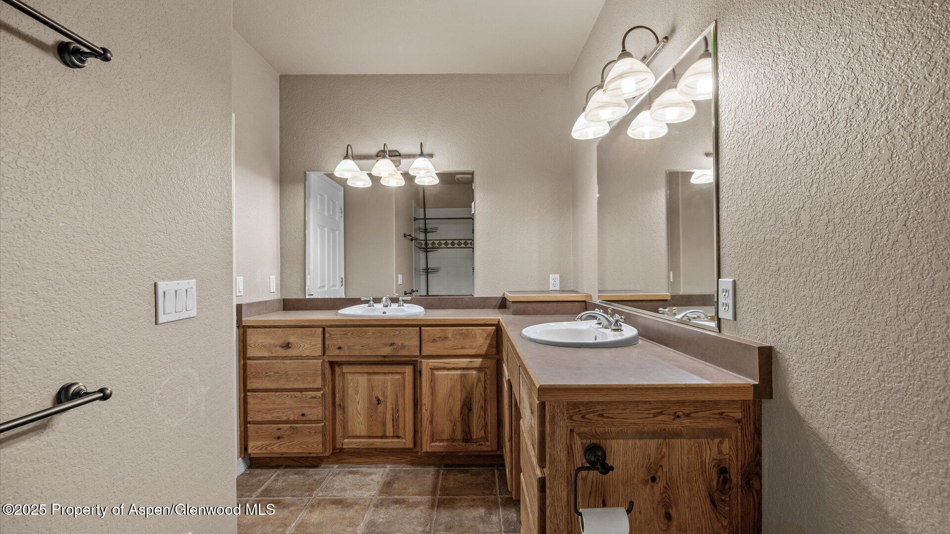 2426 H Road Grand Junction, CO 81505 - Photo 30 of 39 a bathroom with a sink and a mirror