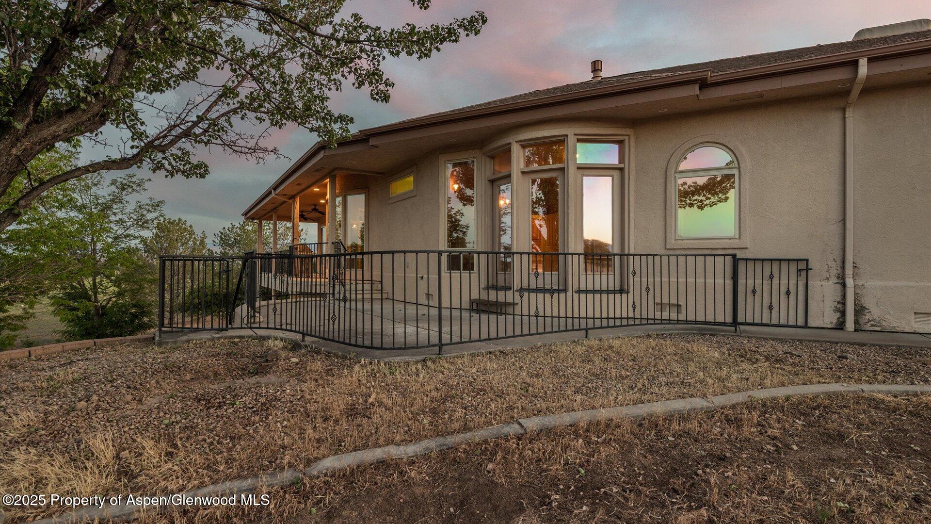 2426 H Road Grand Junction, CO 81505 - Photo 33 of 39 a view of a house with a small yard and wooden fence