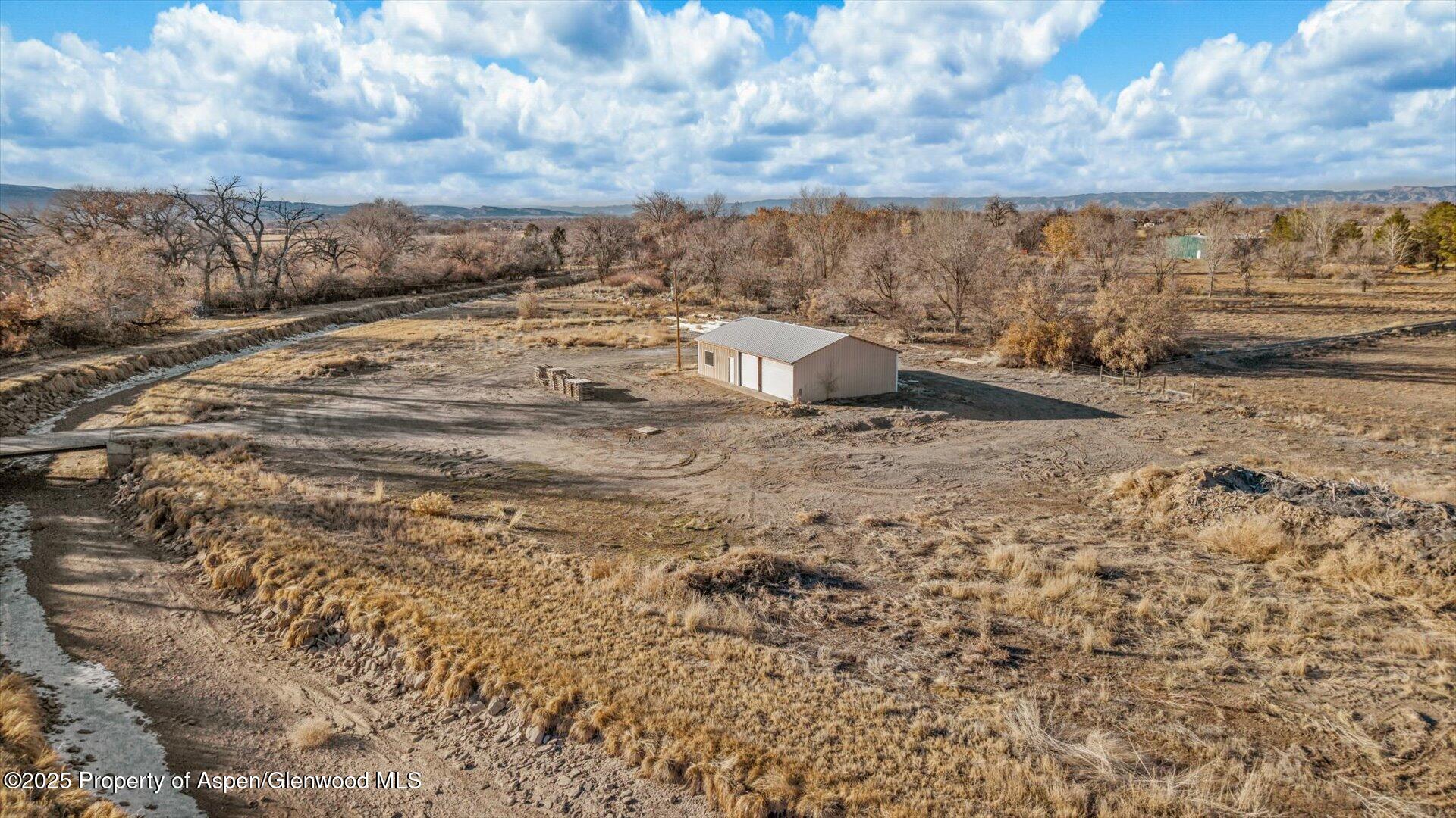 2426 H Road Grand Junction, CO 81505 - Photo 35 of 39 a view of a dry yard with wooden fence