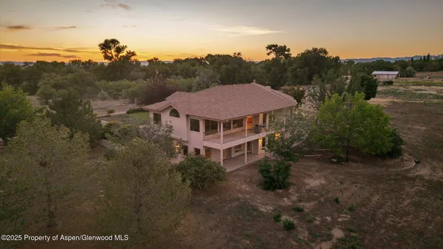 a aerial view of a house with a yard
