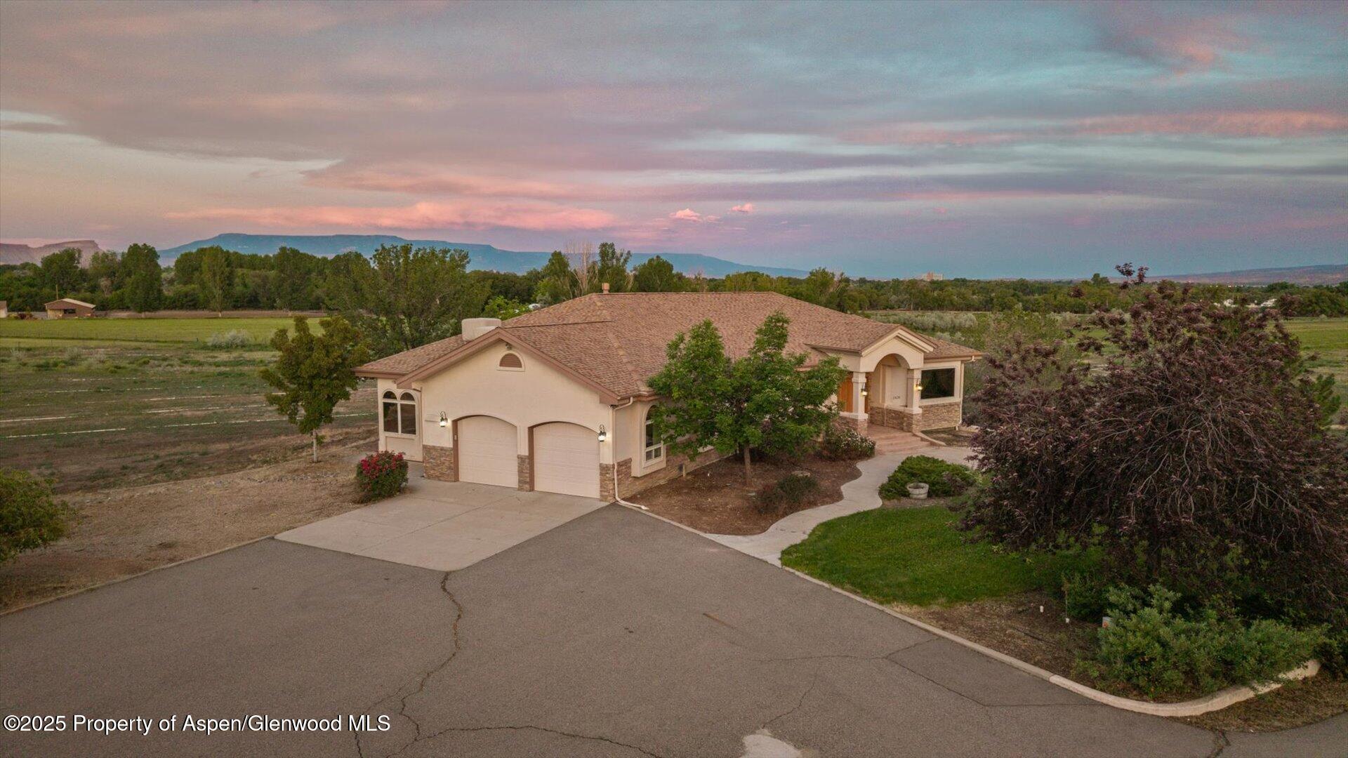 2426 H Road Grand Junction, CO 81505 - Photo 6 of 39 a view of a house with a yard and potted plants