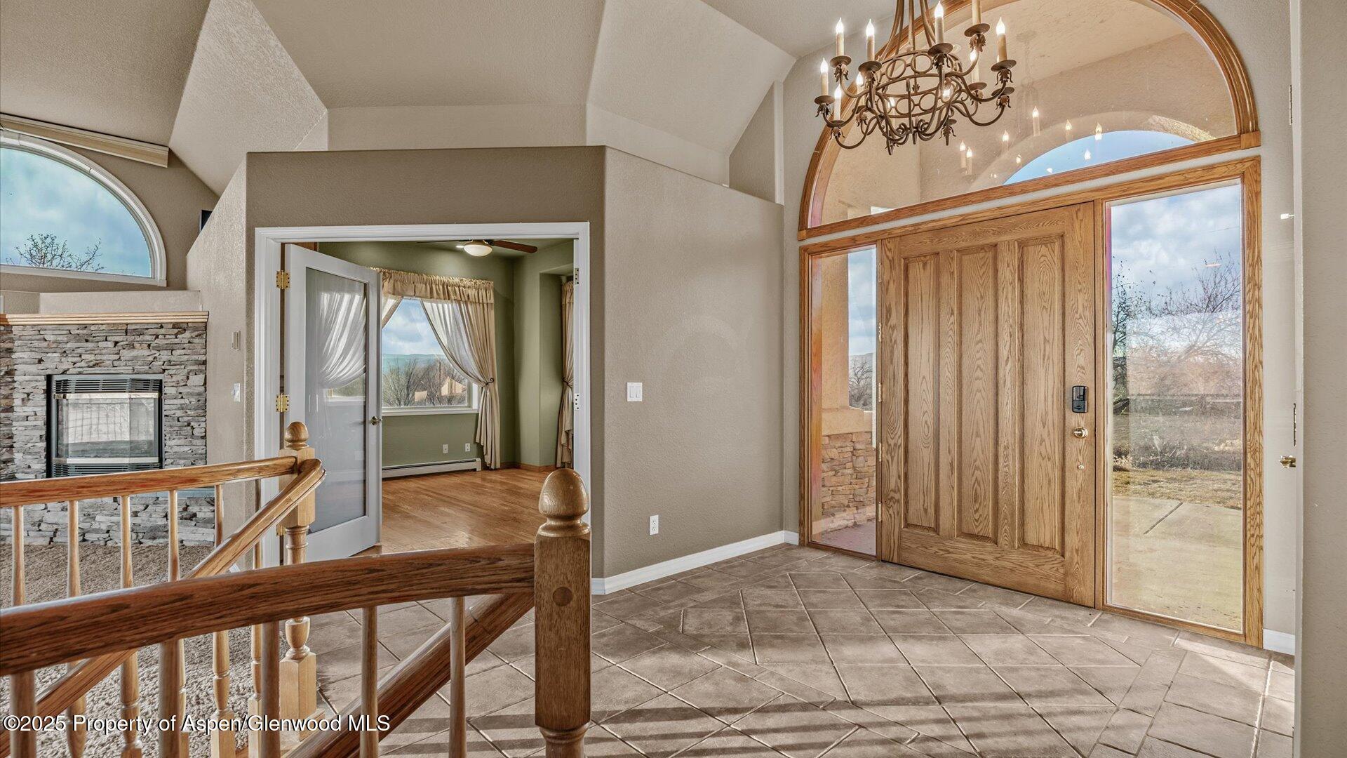 2426 H Road Grand Junction, CO 81505 - Photo 10 of 39 a view of a hallway with a chandelier