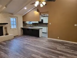 a view of kitchen with sink microwave and refrigerator