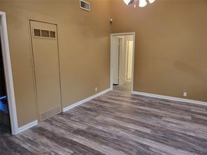 5728 Rockhill Road Fort Worth, TX 76112 - Photo 20 of 38 a view of empty room with wooden floor