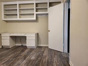 5728 Rockhill Road Fort Worth, TX 76112 - Photo 21 of 38 a view of empty room with wooden floor and fan