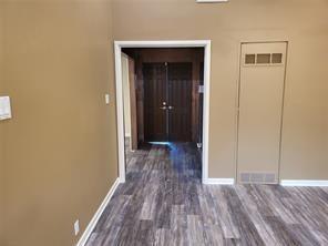 5728 Rockhill Road Fort Worth, TX 76112 - Photo 25 of 38 a view of a hallway with wooden floor