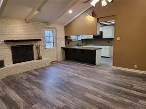 a kitchen with granite countertop a stove top oven and sink
