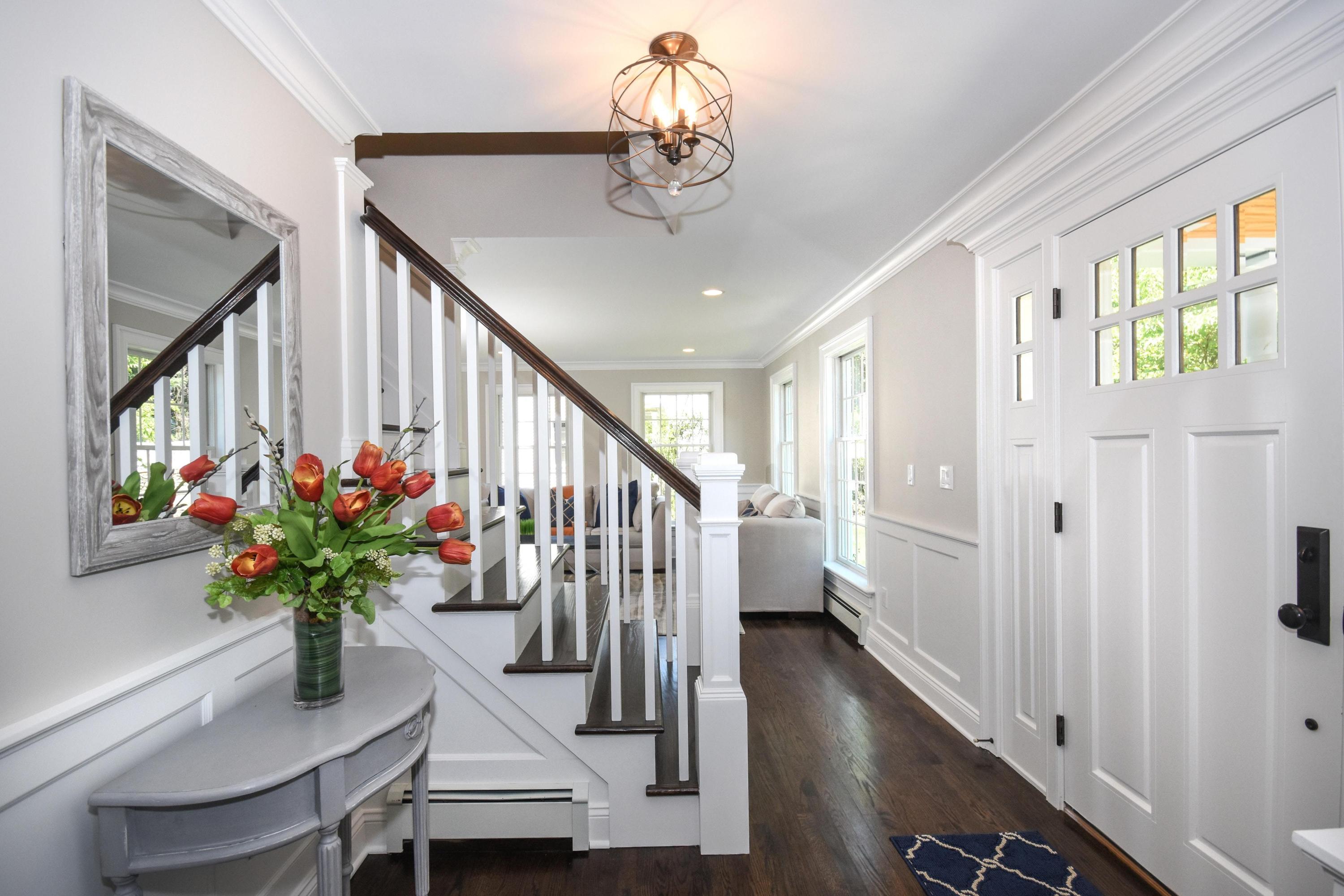 29 Brookside Road Darien, CT 06820 - Photo 2 of 26 a vase of flowers sitting on a table with a living room