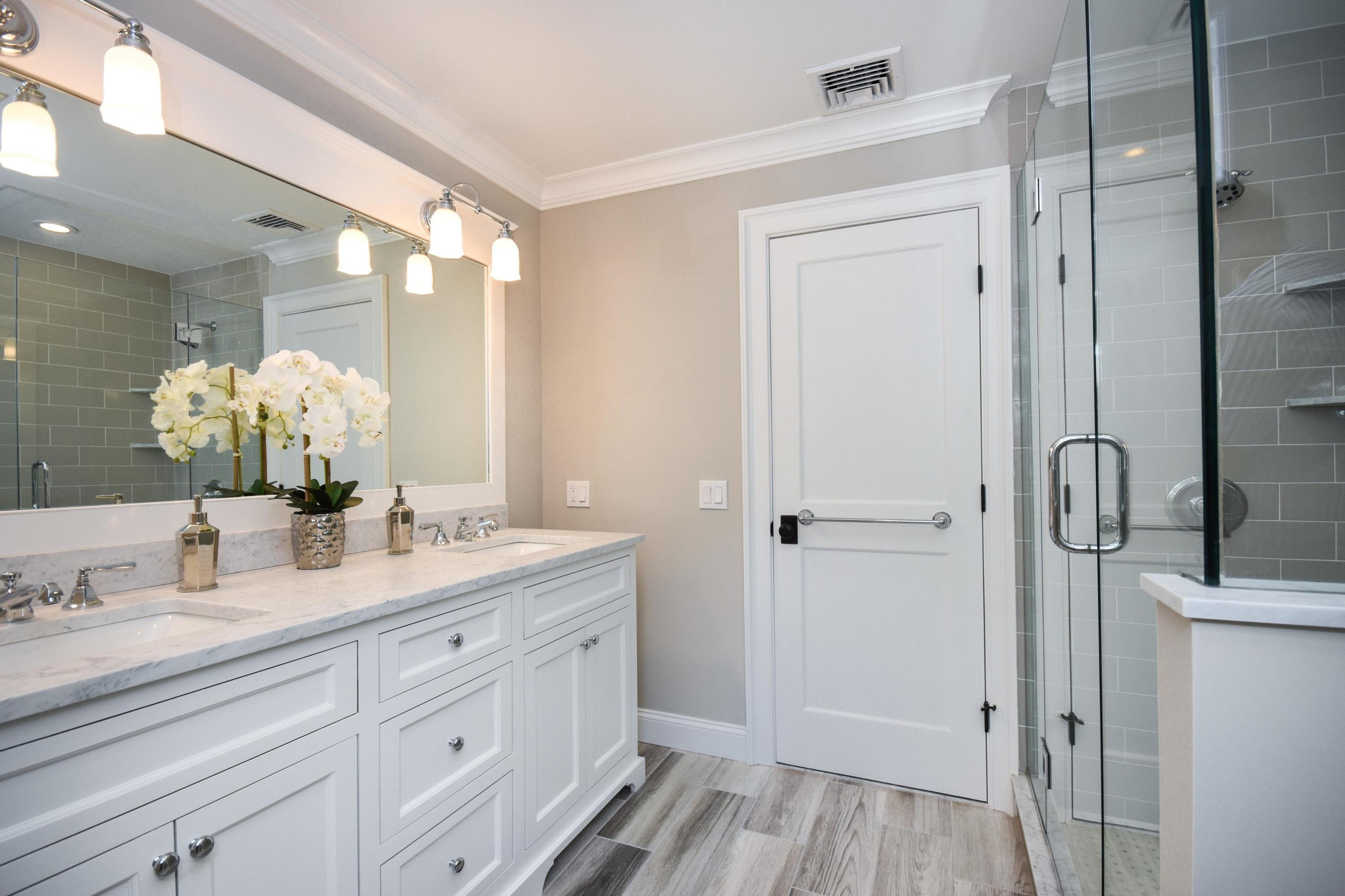 29 Brookside Road Darien, CT 06820 - Photo 15 of 26 a bathroom with a double vanity sink and mirror with shower